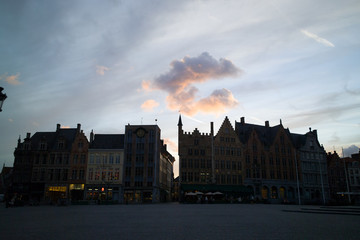 silhouette of building in brugge at sunset