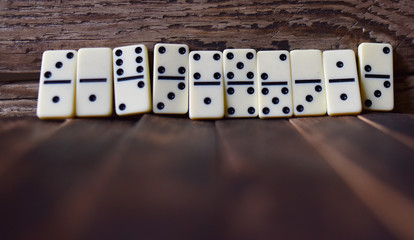 white dominoes on a wooden table