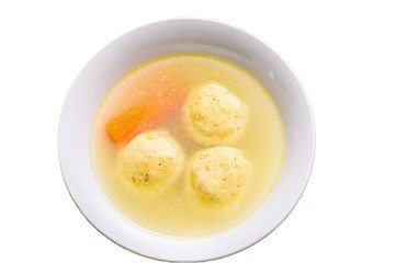 Flat lay isolated traditional matzah ball (kneidlach) soup.White bowl with authentic matzo ball chicken taste hot soup ( bouillon ) isolated on white background. Jewish food for Passover and every day