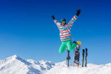 Man skier jumping and having fun in the winter ski resort.
