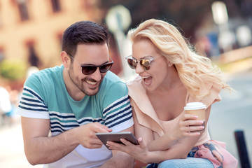 Young couple with digital tablet