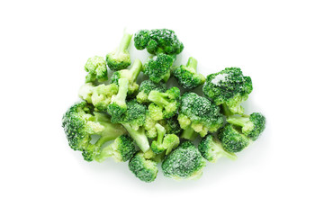 Heap of frozen broccoli isolated over white