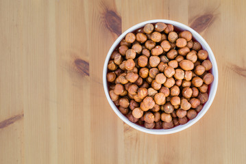 Hazelnuts in a bowl, top view