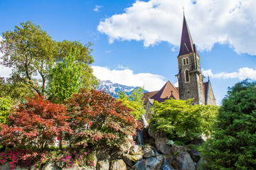 Japanese Garden of Friendship in Interlaken. View of the Church of the Holy Spirit