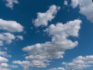 Naklejka na ściany i meble Beautiful white clouds in the blue sky