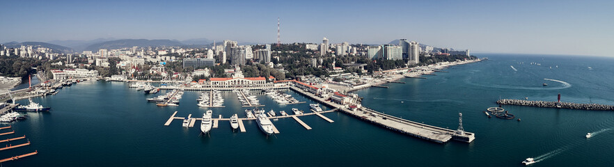 Yachts and boats anchored in the port of Sochi at sunset. Russia. Aerial view