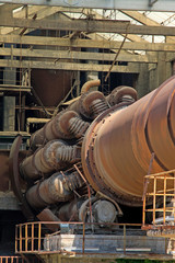 Fototapeta na wymiar idle cement plant rotary kiln machinery