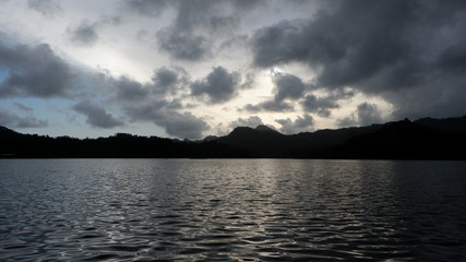 the view of the reddish blue sky at the lake at sunset