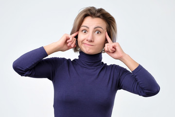 Woman generates new idea in mind, looks thoughtfully