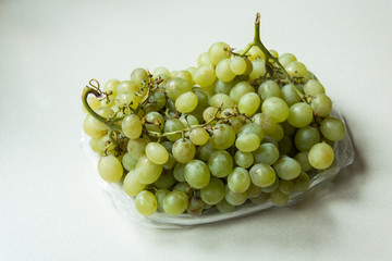 Green grapes on a clear countertop