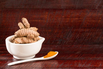 Turmeric spice used in alternative medicine - Curcuma longa. space text