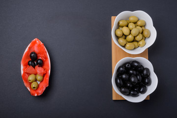 olives and black olives in a bowl and ginger