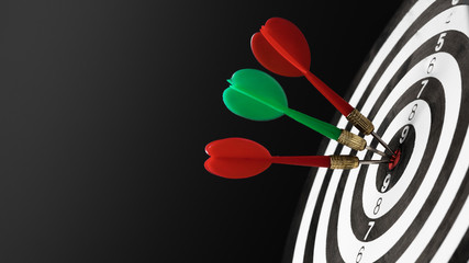 Dartboard with dart in center. Concept of target in business and success