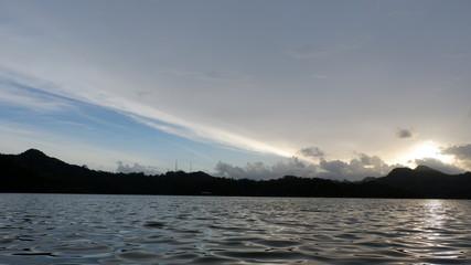 the view of the reddish blue sky at the lake at sunset