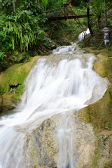 Fototapeta na wymiar beautiful waterfalls flowing from springs in the forest