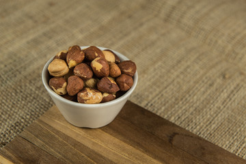 walnuts in a bowl on wooden table