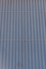 Corrugated aluminum. Finish exterior facades aluminum. Shopping center. Bulbs for night lighting....