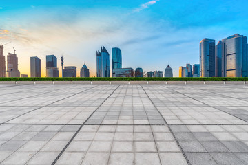 Empty Plaza Floor Bricks and the Skyline of Modern Urban Architecture in Qingdao..
