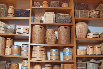 Room decoration in rustic style with many different baskets and barrels