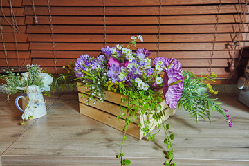 Plastic flowers in wooden box decoration element of interior
