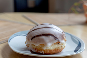 Fresh sugar powdered donuts with vanilla cream filling