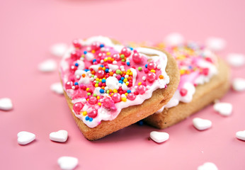 Valentine cookies on pink background.