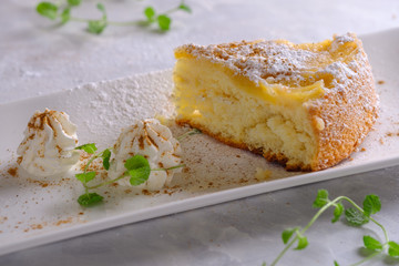 Fragrant charlotte with fresh apples and powdered sugar.