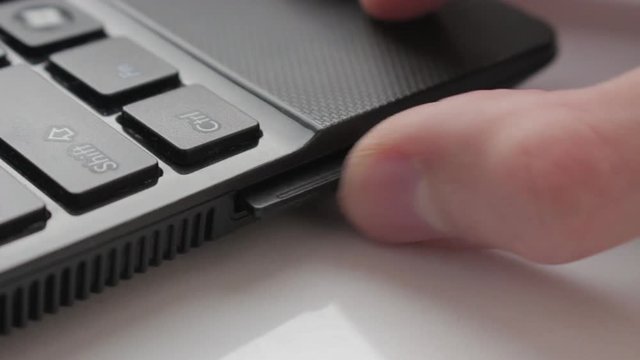 Inserting and Removing a SD Card from a Laptop. Flat Picture Profile