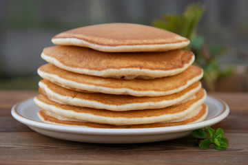 Pancakes. Stack of isolated american pancakes over wooden table. breakfast, food.