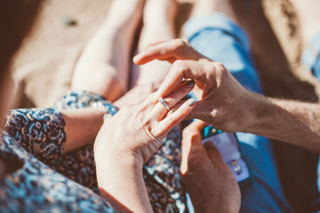 closeup of hands with wedding rings