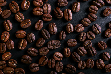 Fragrant coffee beans on rustic tabletop background. Banner copy space.
