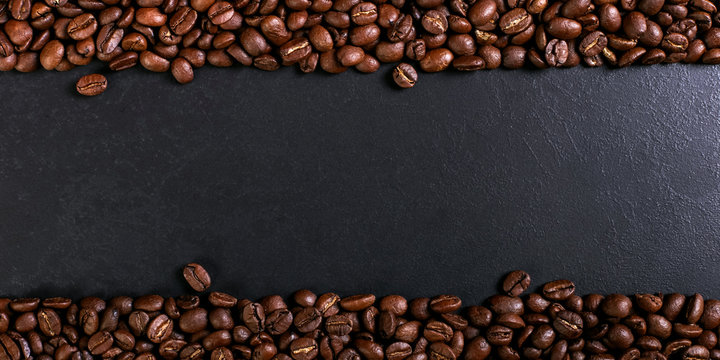 Aroma roasted coffee beans on rustic tabletop, brown banner background. © Plutmaverick