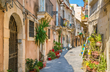 Fototapeta na wymiar Picturesque street in Ortigia, Siracusa old town, Sicily, southern Italy.