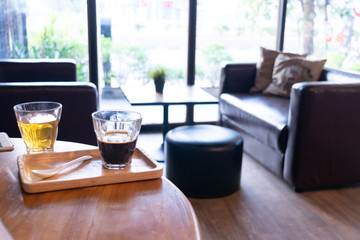 Hot coffee and hot tea on table wood in a living room