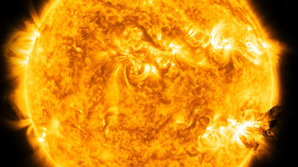 Solar flare radiation and a big eruption of plasma . Elements of this image furnished by NASA