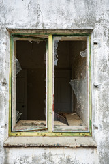 Fototapeta na wymiar Opened window glass broken to an abandon building