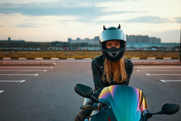 Urban modern lifestyle, extreme sports, speed and adrenaline concept. Attractive blonde girl...