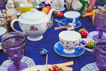 Tea party with cupcakes and different colorful cups