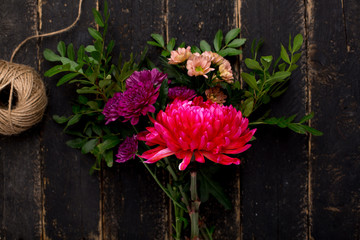 A bouquet of beautiful flowers for the holiday on a wooden background