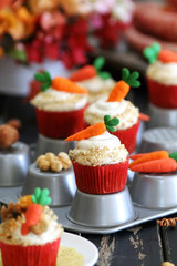 Easter cupcakes baked with carrot decorated with small figures