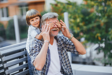 Grandfather with a grandson on a walk