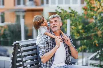 Grandfather with a grandson on a walk