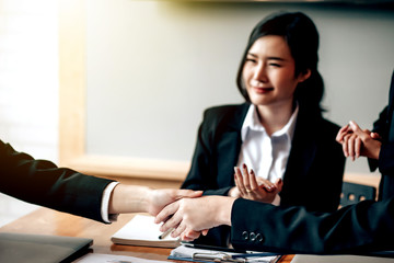 Businesswoman shaking hands. Congratulations and success of the business at meeting.