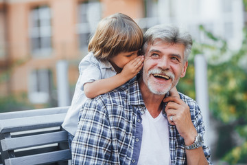 Grandfather with a grandson on a walk