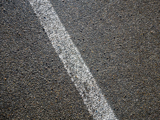 Fototapeta premium Image of white line on asphalt on street