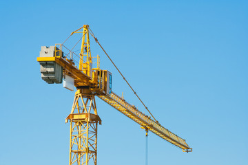 Construction industry of Engineer Business, Technology Concept with Industrial yellow cranes with blue sky ,clouds background