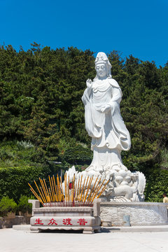 White statue of Buddha near Dianzi Village, in the North East of Beichangshandao Island, Changdao Islands, Shandong, China
