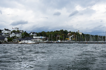 Houses along the harbour of Bygdoy peninsula, Oslo, Norway