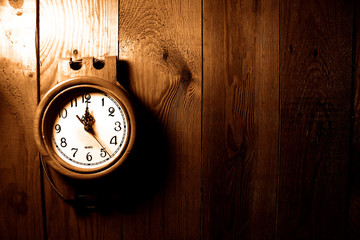 old clock on a wooden surface