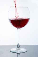 wine in glass on white background